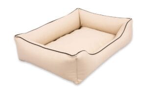 legowisko dla psa alicante typu kanapa beżowe pokazane z boku z czarnym obszyciem